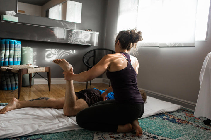 Jessa Munion works with a sports massage client at Rocksteady Bodyworks in Holladay, Utah
